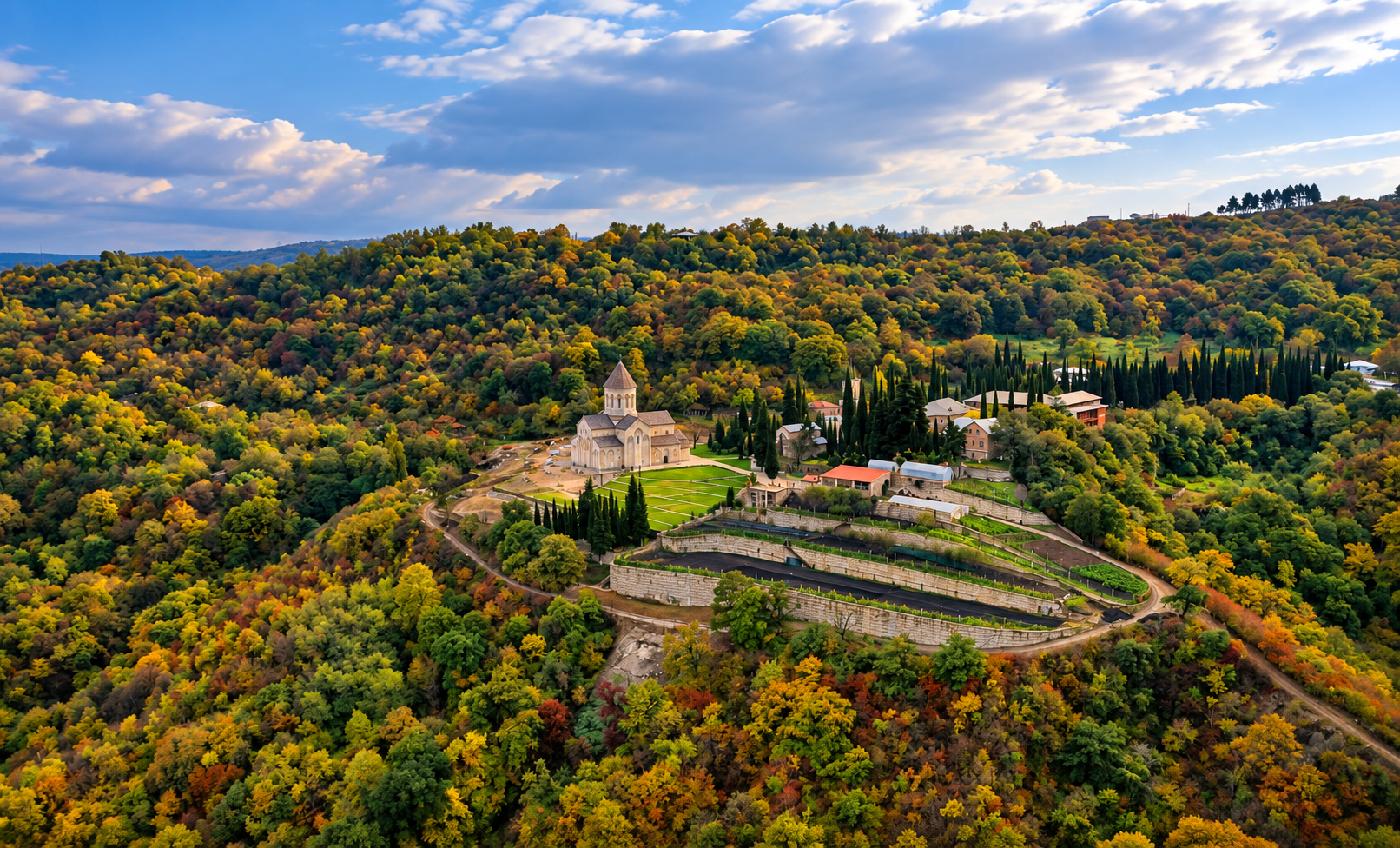 Aerial view of Bodbe Monastery surrounded by the hills of Kakheti, Georgia