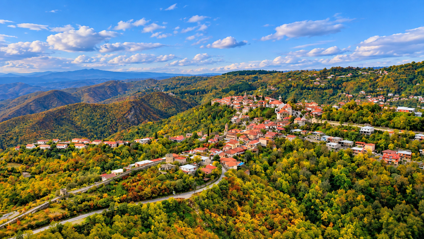 Aerial view of Sighnaghi surrounded by green hills and mountains in Kakheti, Georgia